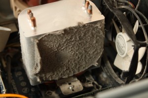 Heat sink,  fan taken off, before cleaning up dust